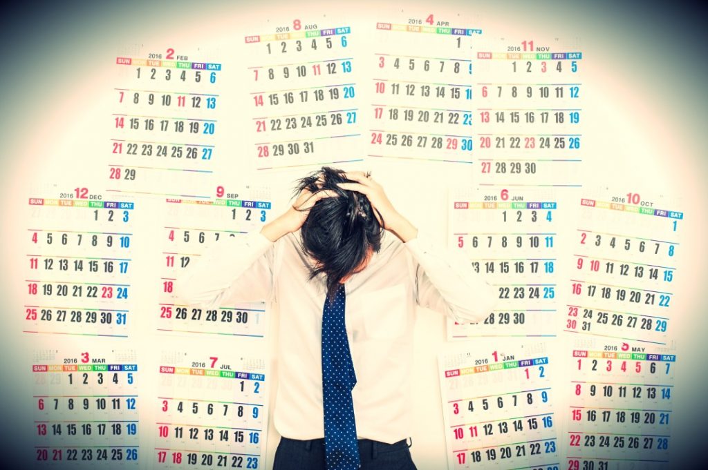 頭を抱えるビジネスマン